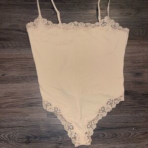 SKIMS Lace Trim Bodysuit in Cream